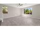 Bright living area with expansive windows and staircase at 11847 Corenzio Ave, Las Vegas, NV 89138
