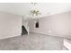 Open living area with tile flooring and view of staircase at 11847 Corenzio Ave, Las Vegas, NV 89138