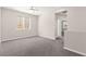 Open loft area with large window and soft carpet flooring at 11847 Corenzio Ave, Las Vegas, NV 89138