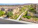 Charming community street view showcasing desert landscaping, sidewalks and beautiful homes at 11847 Corenzio Ave, Las Vegas, NV 89138