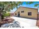 Backyard with a patio, fire pit, and shade tree for relaxing at 1212 E Rome Blvd, North Las Vegas, NV 89086