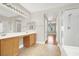 Spacious bathroom with double vanity, ample lighting, and a separate shower at 1212 E Rome Blvd, North Las Vegas, NV 89086
