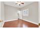 Bedroom with hardwood floors, a window and a door leading to a walk-in closet at 1212 E Rome Blvd, North Las Vegas, NV 89086