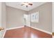 Bedroom view with a closet; note the ceiling fan and wood-look floors at 1212 E Rome Blvd, North Las Vegas, NV 89086