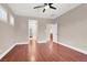 Bedroom with hardwood floors, neutral paint and multiple entry doors at 1212 E Rome Blvd, North Las Vegas, NV 89086