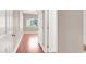 Bright bedroom featuring hardwood floors, a window with shutters, and a ceiling fan at 1212 E Rome Blvd, North Las Vegas, NV 89086