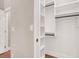 This is an empty white closet with built-in shelves and a hanging bar at 1212 E Rome Blvd, North Las Vegas, NV 89086