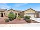 Beautiful single-story home featuring desert landscaping and an attached two-car garage at 1212 E Rome Blvd, North Las Vegas, NV 89086