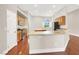 Bright kitchen features stainless appliances, wood cabinets, and granite counters at 1212 E Rome Blvd, North Las Vegas, NV 89086