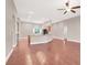 Open concept living area with hardwood floors and views of the kitchen area at 1212 E Rome Blvd, North Las Vegas, NV 89086