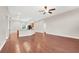 Open-concept living room boasts wood floors and is adjacent to the kitchen area at 1212 E Rome Blvd, North Las Vegas, NV 89086