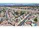 Scenic aerial perspective of a Primary-planned neighborhood with diverse housing, landscaped yards, and easy highway connections at 130 Park Ridge Ln, Henderson, NV 89002