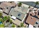Overhead aerial shot shows the roof, yard, and surrounding properties at 130 Park Ridge Ln, Henderson, NV 89002