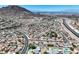 Beautiful aerial view of a residential neighborhood with pools, landscaping, and highway access at 130 Park Ridge Ln, Henderson, NV 89002