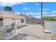 Backyard featuring a covered patio, gravel landscaping, and block wall at 130 Park Ridge Ln, Henderson, NV 89002