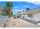 Backyard featuring a covered patio, desert landscaping, and perimeter block wall at 130 Park Ridge Ln, Henderson, NV 89002