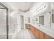 Bright and spacious bathroom with double sinks, tile flooring, and long vanity with ample storage at 130 Park Ridge Ln, Henderson, NV 89002