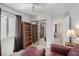 Bonus room featuring bookshelves, sitting area, and a large window overlooking the backyard at 130 Park Ridge Ln, Henderson, NV 89002