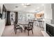 Open dining area adjacent to kitchen, with natural light from the slider to the patio at 130 Park Ridge Ln, Henderson, NV 89002