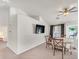 Dining room with vaulted ceilings and a view to the backyard at 130 Park Ridge Ln, Henderson, NV 89002