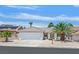 Charming single-story home with a well-manicured yard and attached two-car garage at 130 Park Ridge Ln, Henderson, NV 89002