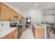 Galley kitchen features gas range, stainless appliances and tile flooring at 130 Park Ridge Ln, Henderson, NV 89002