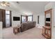 Inviting living room with neutral carpet, ample seating, large windows, and attractive decor at 130 Park Ridge Ln, Henderson, NV 89002