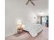 Main bedroom featuring neutral carpet, ceiling fan, and bright window at 130 Park Ridge Ln, Henderson, NV 89002