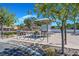 Seating area in a park with bike racks, map kiosk, and green space at 130 Park Ridge Ln, Henderson, NV 89002