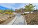 Cement walking path with railings alongside the community skate park at 130 Park Ridge Ln, Henderson, NV 89002