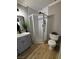 Bathroom featuring new vanity, framed shower, and toilet at 150 Greenbriar Townhouse Way, Las Vegas, NV 89121
