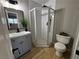Modern bathroom boasts new shower, vanity with storage, mirror and updated fixtures at 150 Greenbriar Townhouse Way, Las Vegas, NV 89121