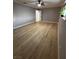 This bedroom offers wood floors, neutral paint, and natural light at 150 Greenbriar Townhouse Way, Las Vegas, NV 89121
