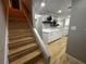 Entryway with wood-look flooring leading to kitchen and stairs at 150 Greenbriar Townhouse Way, Las Vegas, NV 89121