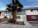 Charming townhome with two palm trees, a well-kept exterior, and inviting curb appeal at 150 Greenbriar Townhouse Way, Las Vegas, NV 89121