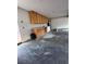 Spacious garage area with cabinets, utility sink, and laundry appliances at 150 Greenbriar Townhouse Way, Las Vegas, NV 89121