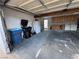 Functional garage with laundry area, cabinets, ample parking, and space for additional storage at 150 Greenbriar Townhouse Way, Las Vegas, NV 89121
