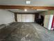 Spacious garage with overhead lighting, plenty of parking, and room for storage at 150 Greenbriar Townhouse Way, Las Vegas, NV 89121