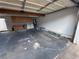 Spacious garage with overhead storage cabinets, laundry area, and room for parking at 150 Greenbriar Townhouse Way, Las Vegas, NV 89121