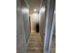 Hallway featuring wood floors, neutral paint, and white doors at 150 Greenbriar Townhouse Way, Las Vegas, NV 89121
