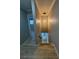 Hallway with wood-look flooring, modern lighting, and access to various rooms at 150 Greenbriar Townhouse Way, Las Vegas, NV 89121