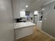 Modern kitchen featuring white cabinets and light countertops at 150 Greenbriar Townhouse Way, Las Vegas, NV 89121