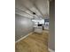 Eat-in kitchen with modern lighting and white cabinets at 150 Greenbriar Townhouse Way, Las Vegas, NV 89121