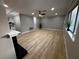 Spacious living room offering fireplace, new flooring, ceiling fan, and lots of natural light at 150 Greenbriar Townhouse Way, Las Vegas, NV 89121
