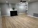 Open-concept living room boasts wood floors, fireplace, and neutral paint at 150 Greenbriar Townhouse Way, Las Vegas, NV 89121