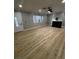 Welcoming living room with light wood flooring and a modern fireplace at 150 Greenbriar Townhouse Way, Las Vegas, NV 89121