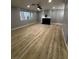 Bright living room featuring light wood floors and a stylish fireplace at 150 Greenbriar Townhouse Way, Las Vegas, NV 89121