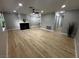 Open-concept living room boasts wood floors, fireplace, and neutral paint at 150 Greenbriar Townhouse Way, Las Vegas, NV 89121