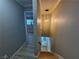 Hallway leading to a basement staircase at 150 Greenbriar Townhouse Way, Las Vegas, NV 89121