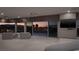 Expansive main bedroom with seating area and stunning views of the city skyline at sunset at 1683 Tangiers Dr, Henderson, NV 89012